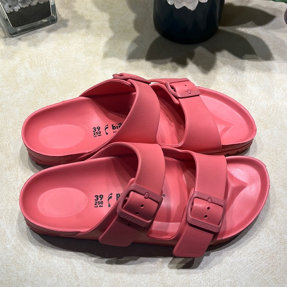 Birkenstock EVA Arizona slides.  Size 8, coral color.  Excellent used condition!